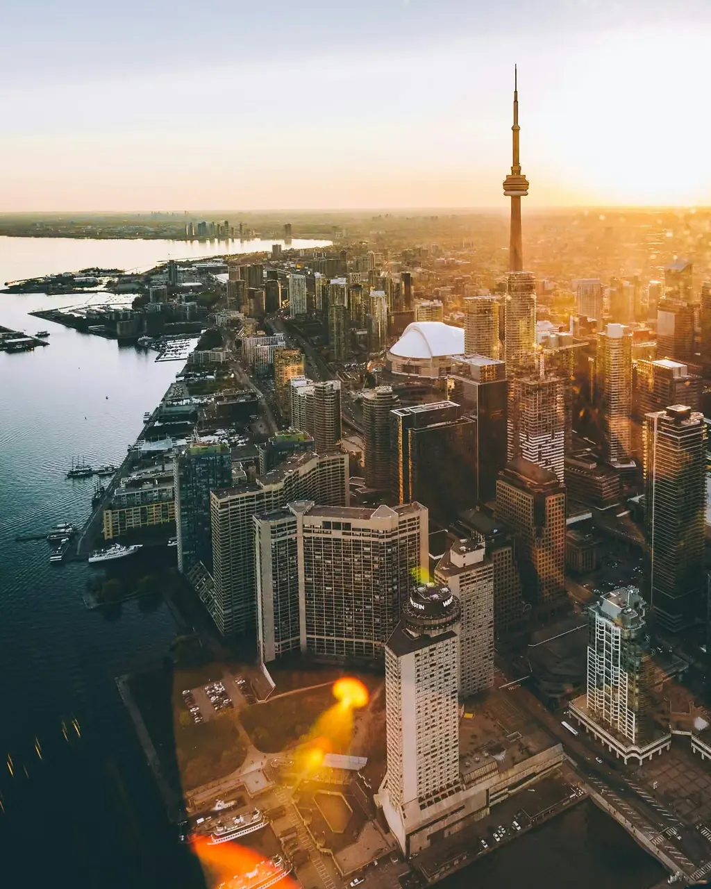 Aerial view of downtown Toronto and the CN Tower at golden hour